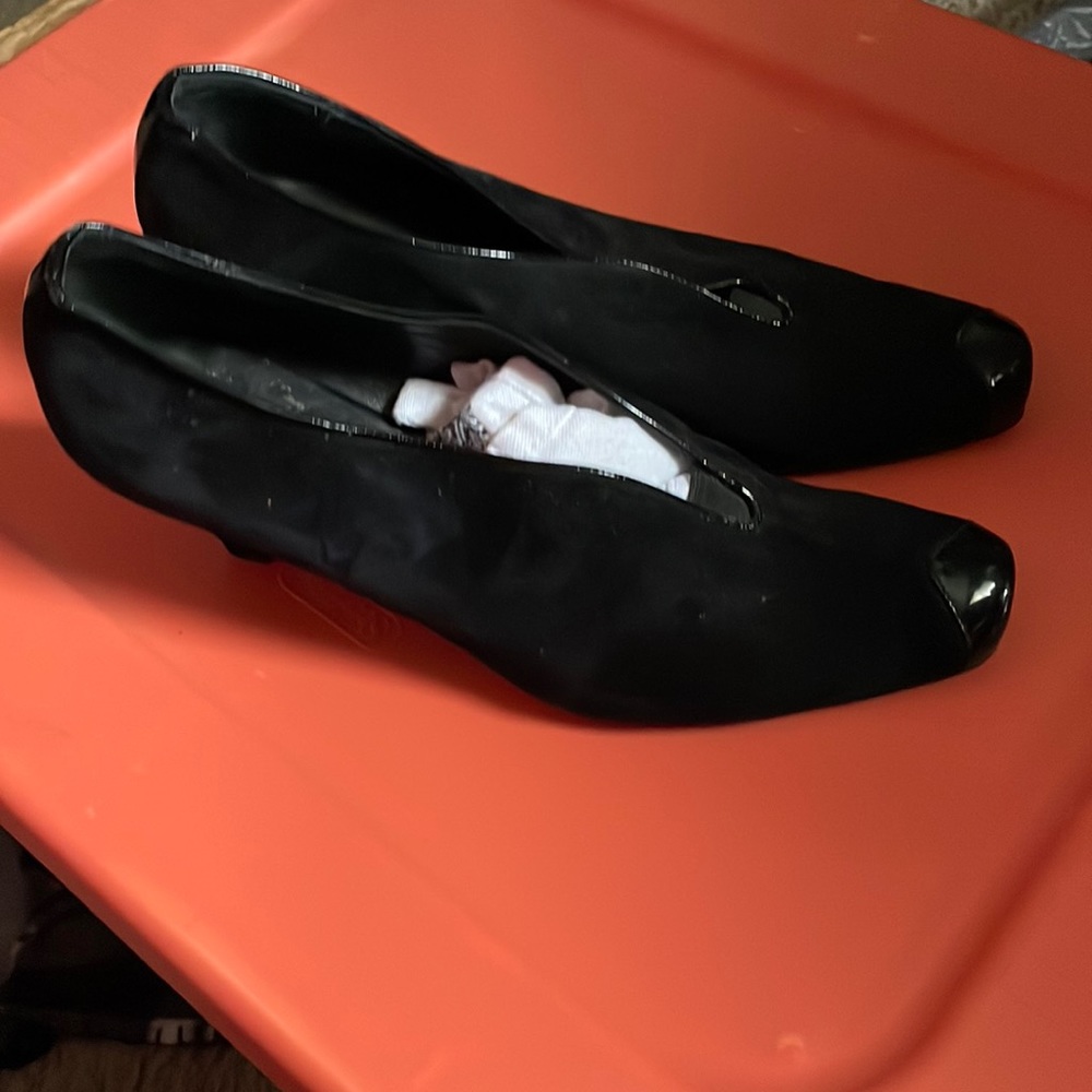 Suede and patent leather heels.